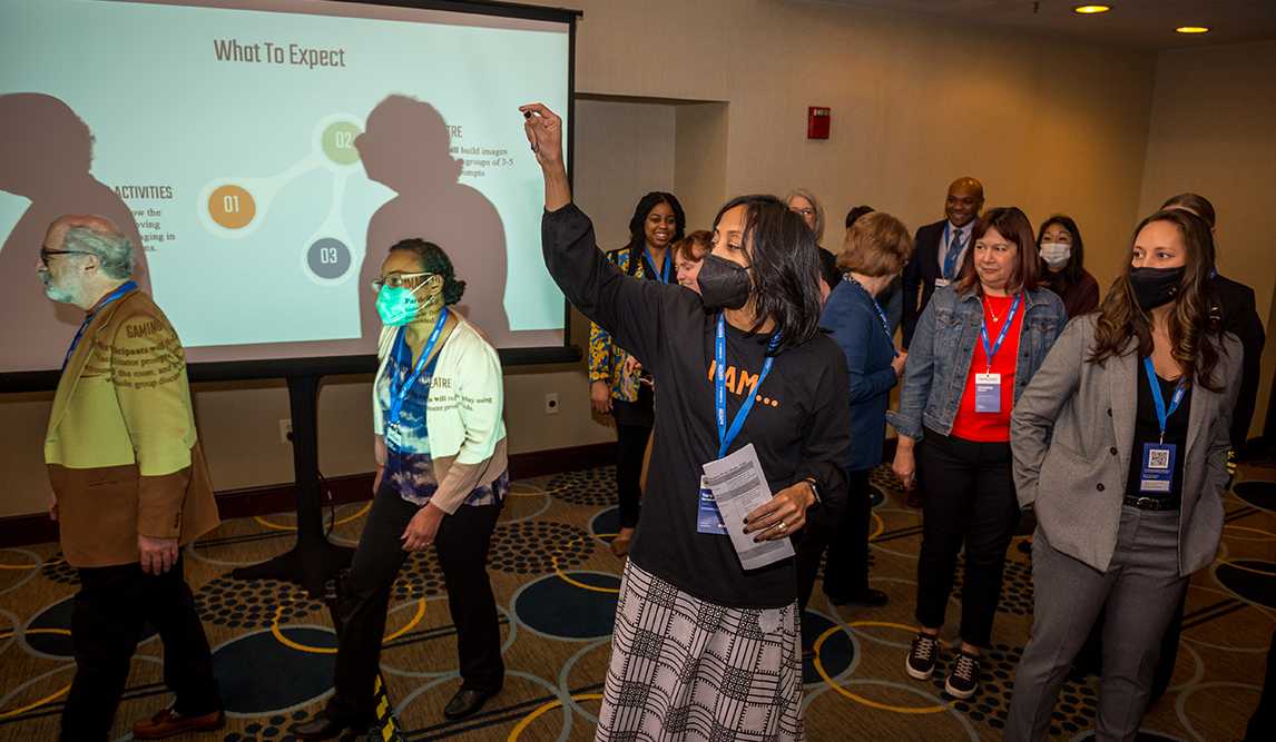 Dr. Tara Nkrumah facilitates a learning session using dramatization techniques during the 2023 DoW STEM Technical Exchange in Washington, DC.