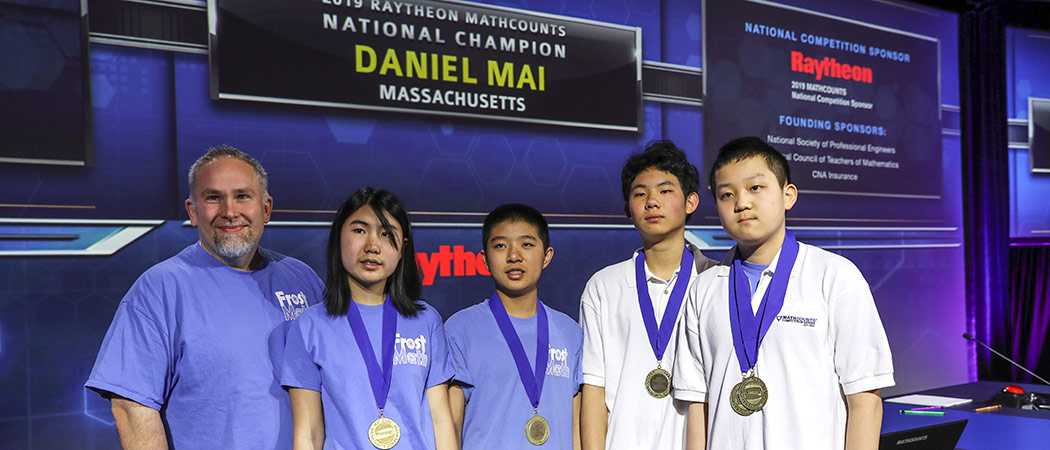 Winners of the Mathletes competition standing with their medals.